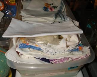 Vintage handiwork items, from towels to napkins, and decorative pieces too.