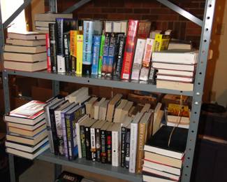 We have books on shelves, and believe it or not, we have about 22 more boxes of books as well!