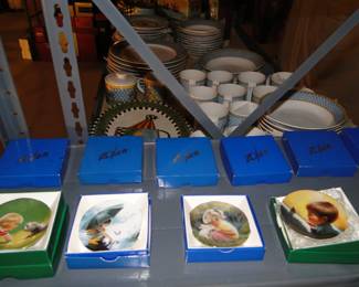 Collectible plates in the original boxes