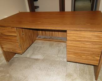 This is the only piece of furniture that we have on the upper level.  It is a desk, a functional desk.  It is plain, it is simple, it is a desk.  If you would like to visit this nice desk , please let a staff member know.