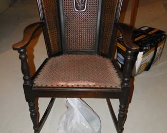 Fan back chair, complete with caning, with great detail.  Comfortable rocking chair.