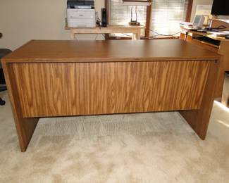 This is the only piece of furniture that we have on the upper level.  It is a desk, a functional desk.  It is plain, it is simple, it is a desk.  If you would like to visit this nice desk , please let a staff member know.
