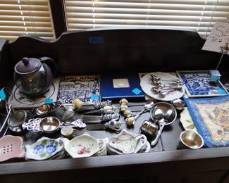 Lots and lots of fine tea and side board items