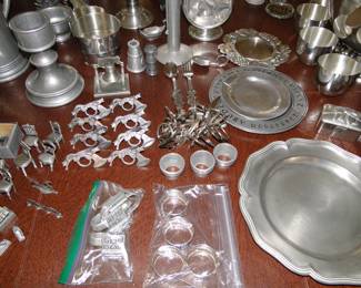 Pewter plates, pewter napkin rings, pewter, pewter, and more pewter.