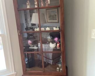 Vintage curio/china cabinet in brown walnut by Davis Cabinet Company.