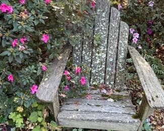 Weathered wood patio chairs.