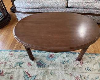 Oval wooden coffee table.