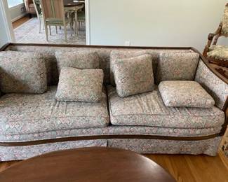 Sofa with wood trim.