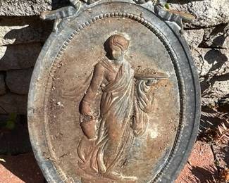 Large cast iron medallion in neo-classical style.