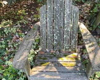 Weathered wood patio chairs.