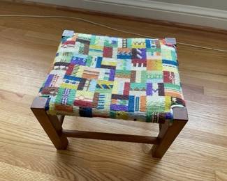 Small footstool with fun bright colors.