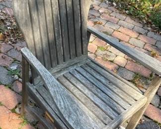Weathered wood patio chairs.