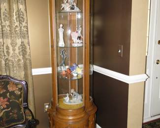 What a unique corner curio cabinet
