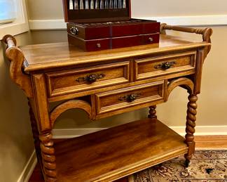 Vintage rolling bar cart with spindle legs