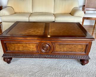 Beautifully detailed coffee table with leather top by Ethan Allen