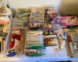 sewing notions, tiny presser irons, cordless electric scissors, pin cushions, buttons, etc