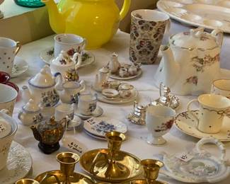 brass candlesticks, tea sets, tea pots, teacups and saucers