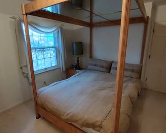 THIS IS AN INTERESTING CANOPY QUEEN BED WITH MIRRORS OR THEY CAN BE TURNED OVER AND BE WOOD. 