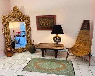 Ornate gold leaf mirror, old door table top, British Colonial rattan tall back throne chair