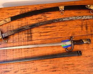 Eagle head early 1800s militia sword
European made for American market
Leather & brass sheath intact

French bayonet
1884
French Gras
