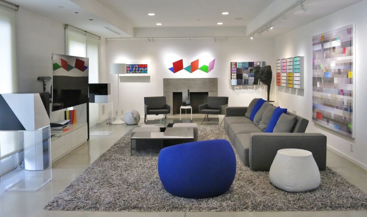 Sofa, Modular Coffee Table, Armchairs and Leather "Fat" Side Table all by B & B Italia.  All Art by Moshe Elimelech