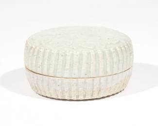 CHINESE QINGBAI PORCELAIN BOX AND COVER | Southern Song-Yuan dynasty (1127-1368), of circular shape with molded floral decoration and ribbed sides
h. 1-3/4 dia. 3-3/4 in.
