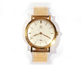 OMEGA 18K GOLD MENS WRISTWATCH | Manual wind, silver face with baton numerals, sub seconds dial, on a fine 14k gold link band, case dia. 37mm, 65.2g, with inscribed dedication dated 1957