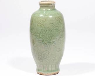 CHINESE LONGQUAN CELADON OVOID VASE | Ming dynasty (1368-1644), of slender ovoid shape with carved floral decoration and crackled green glaze, with conforming wood stand. h. 6-1/2 in.