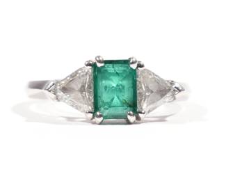 EMERALD, DIAMOND & PLATINUM RING | Accompanied by Oscar Heyman & Brothers, Inc. invoice stating emerald of Zambia origin, 0.63ct., quality very fine, color F-G, clarity VS, flanked by 2 trillion-cut diamonds, size 4-1/2; 4.8g