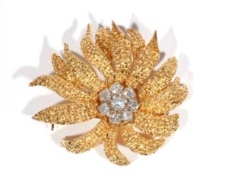 VAN CLEEF & ARPELS 18K GOLD FLOWER BROOCH | Circa 1950s, textured yellow gold, having 8 brilliant round diamonds (F color, VVS clarity) 1 cttw., signed "VCA 750 (c) 61, BIO25A4", with VCA pouch; 20.8g. h. 1-3/8 w. 1-5/8 in.