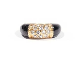 VAN CLEEF & ARPELS DIAMOND, 18K & ONYX LADY'S RING | "Phillipine" ring with two bands of onyx centering 18 melee diamonds, set in 18k yellow gold; size 1.75, 5.4g