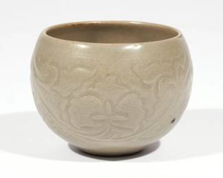 CHINESE YAOZHOU CELADON JAR | Song dynasty (960-1279), possibly a rice measure, of globular form with carved floral decoration, with fitted box
h. 2-1/2 dia. 3-1/4 in.
