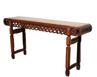LARGE CHINESE CARVED ROSEWOOD ALTAR TABLE | Early – mid 20th century, jichimu and other woods, having archaistic scroll ends, pierced braided link apron, and panels inset with contrasting woods
h. 40-3/4 w. 85-3/4 d. 18 in.