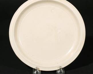 FINE CHINESE DING WARE DISH | Northern Song - Jin dynasty (960-1234), with shallow, flaring sides, covered in an ivory-toned glaze except for the raised outer edge on the flat, everted rim, which reveals the pale porcelain body. dia. 7-1/2 in.