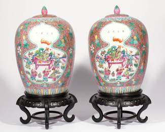 PAIR CHINESE FAMILLE ROSE PORCELAIN JARS & COVERS | Tongzhi (1862-1874) reign marks and of the period, each with gourd-shaped reserves showing figures, one inscribed Dai wan sunzi (Daiwan grandson or Sun Tzu), the other similarly inscribed Ge cheng zi __ (Each becomes a son ___), on a red ground with floral scrollwork. h. 12-1/2 dia. 10 in. (approx). Overall: h. 17-1/2 in. (on stand)