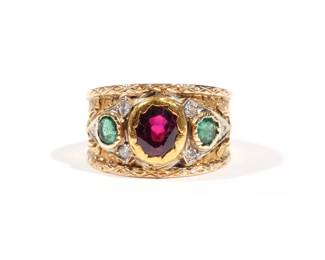 CAZZANIGA 18K GEM STONE RING BANK | 18k yellow gold, with engraved and applied gold decoration, comprising a faceted ruby center stone (1.05 ct), two flanking emeralds (0.44 ct), and melee diamonds; without fineness mark, tested to 18k; with original Cazzaniga receipt dated 1979 and original box; size 5.5