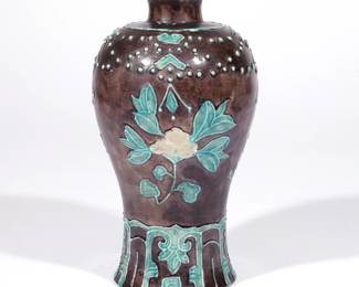 CHINESE FAHUA PRUNUS VASE, MEIPING | Ming dynasty (1368-1644), with carved prunus decoration in turquoise and white on an aubergine ground, with reticulated wood stand, with old partial gallery label "J.T. Tai ..." and Christie's label. h. 8-1/2 in.