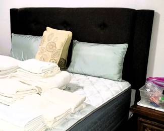 Queen size contemporary bed with upholstered headboard, side panels and foot board