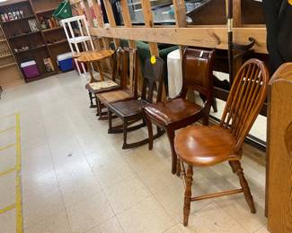 Lots of various chairs and furniture pieces