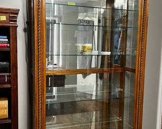Sliding front locking glass door, glass shelves, mirrored back. Solid wood frame. Gorgeous collections, display cabinet.