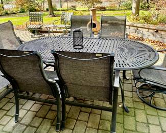 Tropitone Patinated Cast Aluminum Table with 2 Shoreline High Back Sling Swivel Rockers and 4 High Back Sling Dining Chairs plus Bonus Ottoman.  