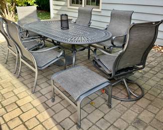 Tropitone Patinated Cast Aluminum Table with 2 Shoreline High Back Sling Swivel Rockers and 4 High Back Sling Dining Chairs plus Bonus Ottoman.  