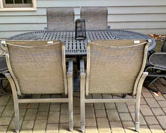 Tropitone Patinated Cast Aluminum Table with 2 Shoreline High Back Sling Swivel Rockers and 4 High Back Sling Dining Chairs plus Bonus Ottoman.  