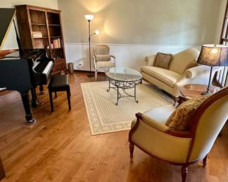 Living Room includes Ethan Allen Camelback Sofa, Ethan Allen Accent Chairs, Kohler & Campbell Baby Grand Piano in Glossy Black and Beautiful Bookshelf