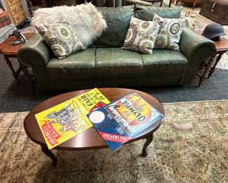 Green leather couch and coffee table