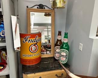 Overview photo of beer collectibles, Indian Motorcycles dresser, mirror and Stroh's beer light