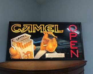 Close up photo of CAMEL window "OPEN" sign