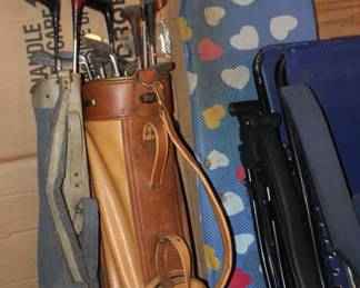 Golf Clubs, Lawn Chairs, Ironing Board