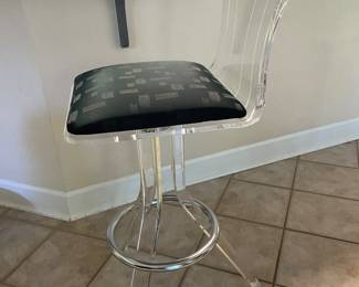 Unusual lucite barstools have 2 bases, one tall and one short legged by Charles Hollis Jones.