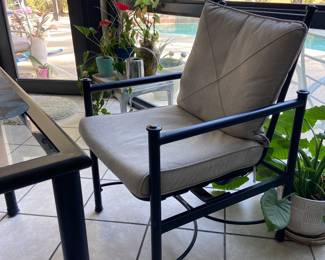 Black wrought iron and glass patio set